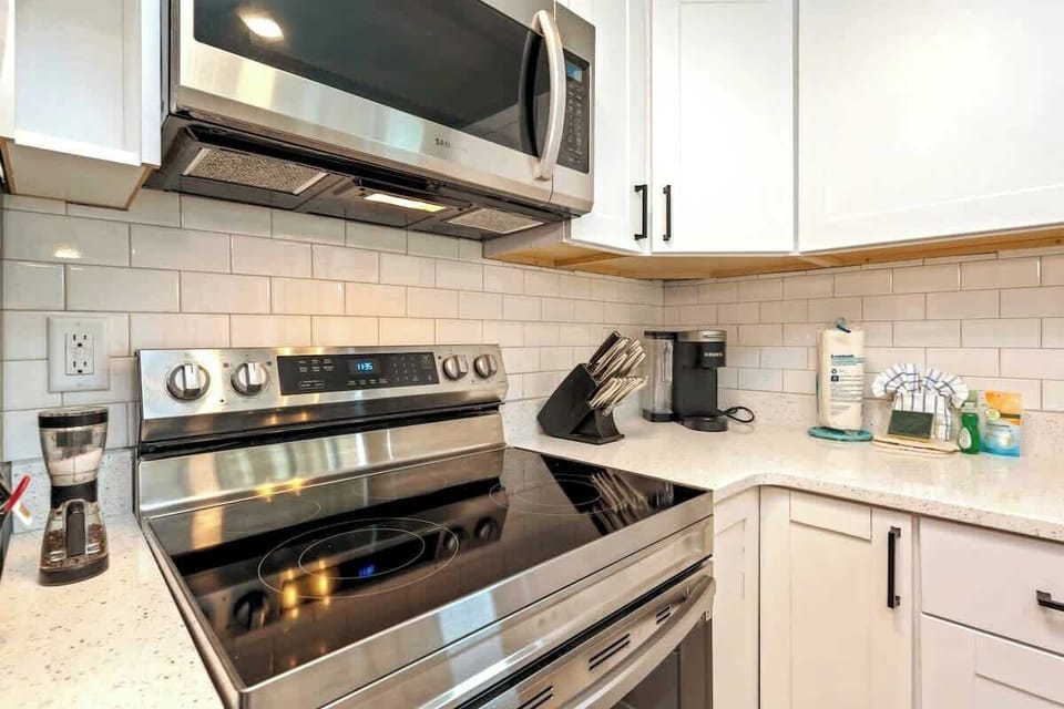 We've stocked this kitchen with full appliances, dishes, bake ware, pots & pans, silverware, utensils, crockpot, blender, and a traditional coffee maker & Keurig!