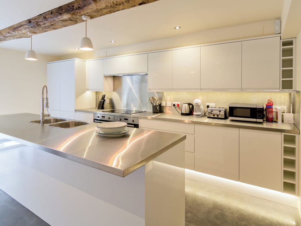 Contemporary fitted kitchen with island | The Cotswolds Barn - Crucis, Ampney Crucis, near Cirencester