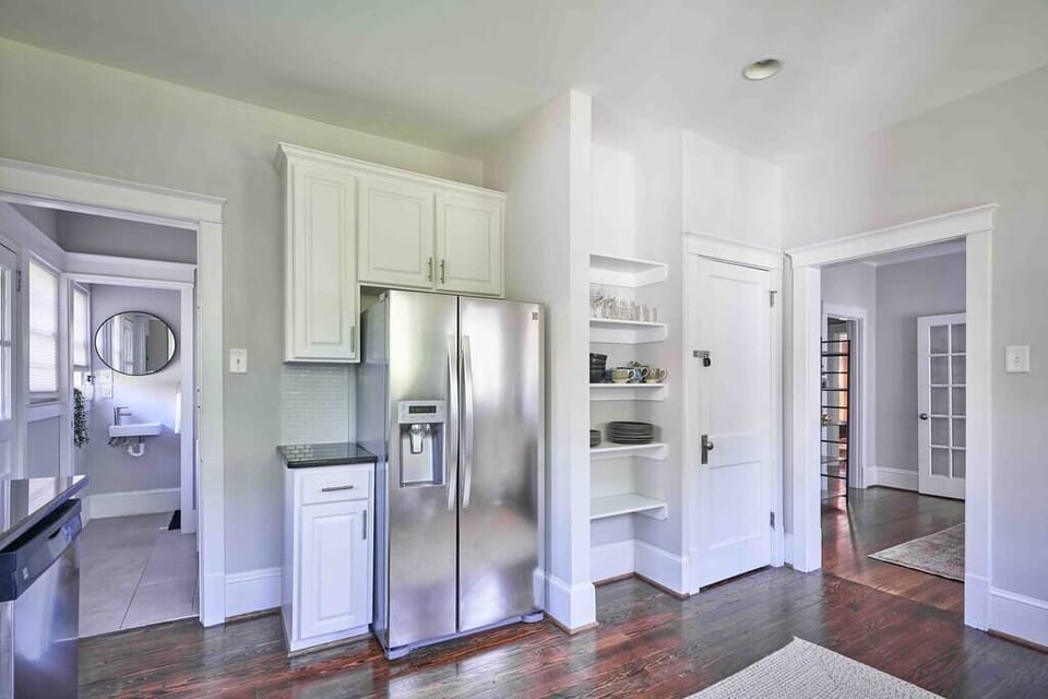 full sized refrigerator and glass and dish ware for your use 