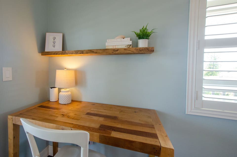 Private desk area in primary bedroom with Wifi extender for high speed internet.
