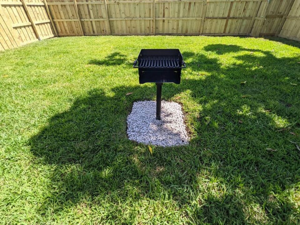 Wonderfully landscaped, private backyard with charcoal grill. You will need to purchase your own charcoal for use.