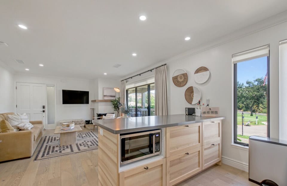 All your cookware, bakeware, and utensils are here. This sleek kitchen is made ever sleeker with camouflaged refrigerator and dishwasher.