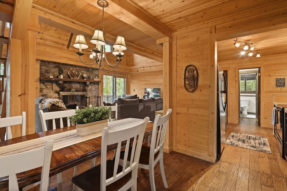 See the living room TV and fireplace from the dining room table.
