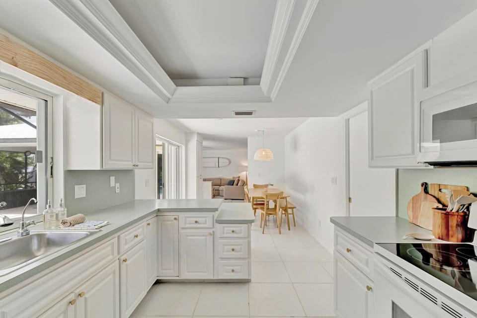 Kitchen looking out into dining area and living room