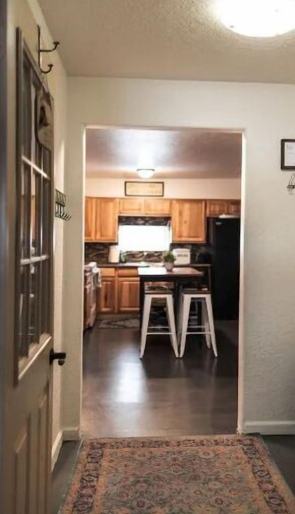 Welcome home! View from arctic entry through mudroom and into kitchen.