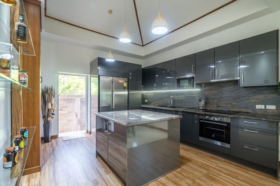 Deluxe Villa | Private kitchen | Fridge, microwave, dishwasher, electric kettle