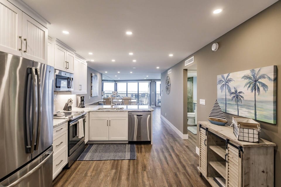 Just inside the exterior entry door, your eyes are met with a stunning space with the incredible water views just beyond.