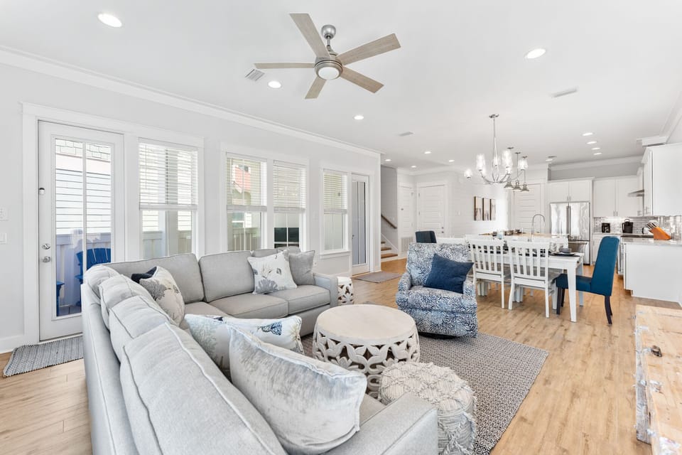 Relax in your spacious open-plan living space with plush sectional seating and modern kitchen flowing seamlessly together for perfect gatherings.