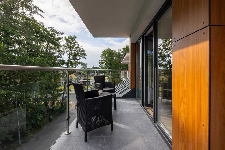 The furnished balcony invites you to relax outdoors.