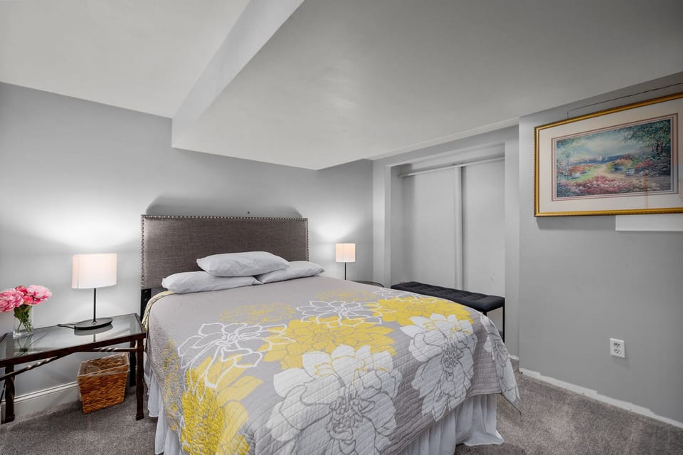 Downstairs/basement bedroom with queen bed