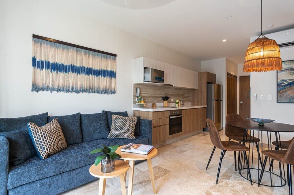 Gather together in the sunlit living room with its high-end sleeper sofa and custom-built furniture while preparing a sumptuous  meal on the granite counter top of our full kitchen. You can spend your day watching on the smart TV equipped with Amazon Prime and Disney plus. Through the living room, you are given access to the balcony where you can let the natural sunlight in as ...