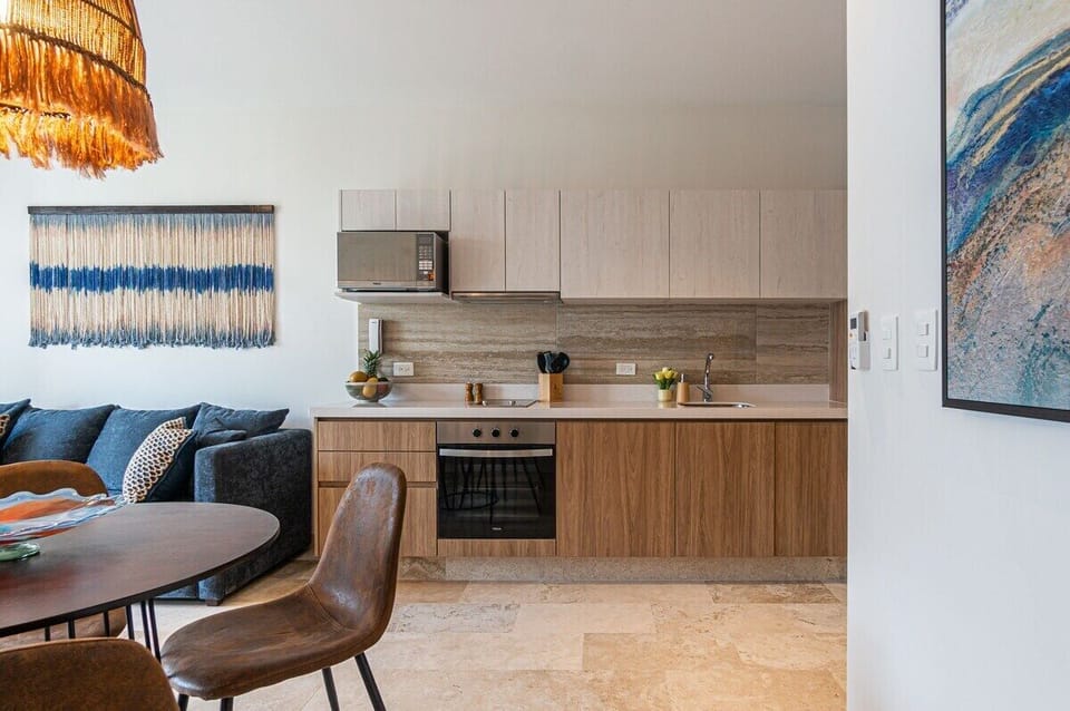 Craft a gourmet meal on the sleek granite countertops of our fully appointed kitchen, all while enjoying the gentle breeze drifting in through the open balcony doors