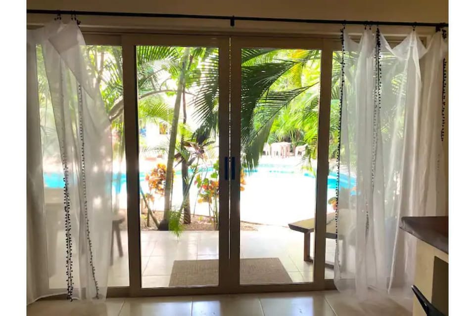 Wake every morning to the lush palms and clear, blue pool