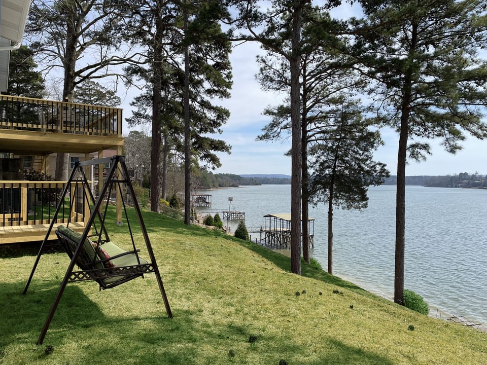 Swing in backyard facing the lake, rear deck in background