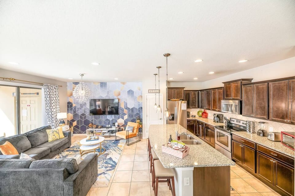 3.	Serve up your kitchen creations on the kitchen island breakfast bar with seating for 4. With an open plan with the living room allowing for connections and fun times, at all times! 