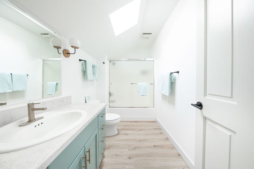 Full bathroom with shower & tub combo upstairs.