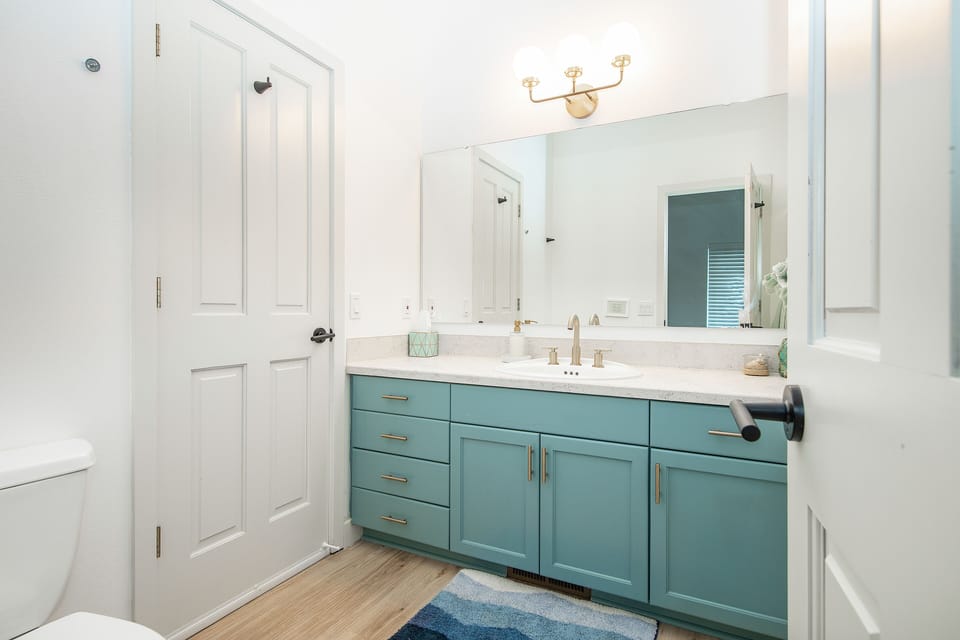 Walking into the bathroom from the bedroom.