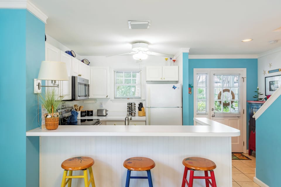 Barstool seating at the kitchen counter.