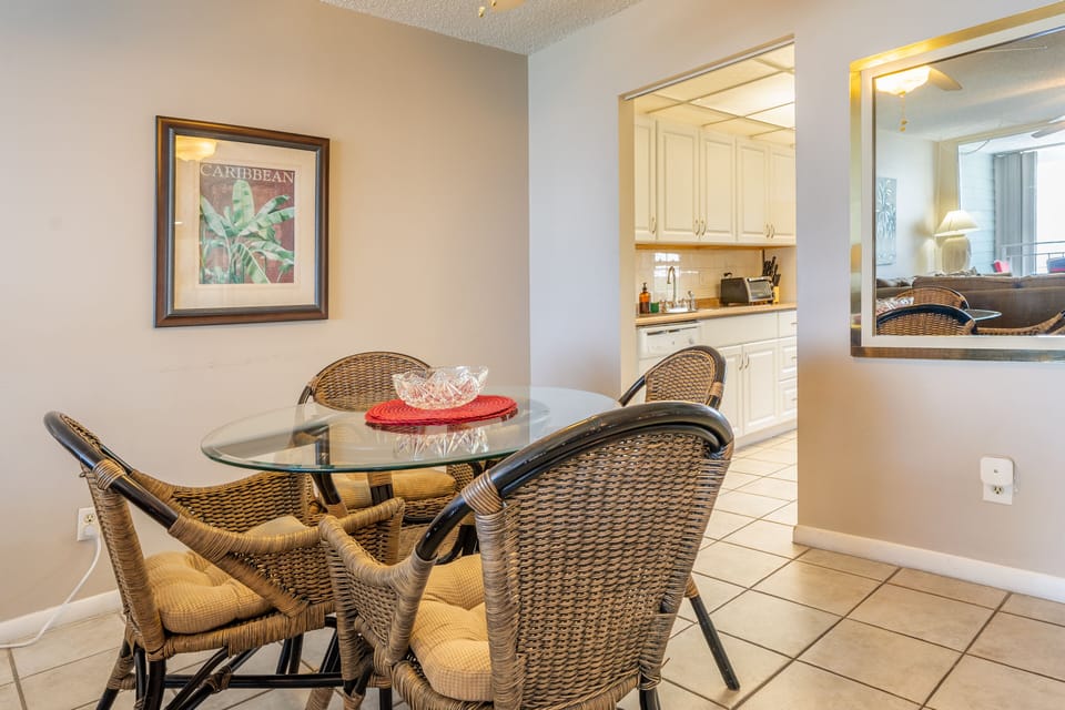 Dining table is near the kitchen.
