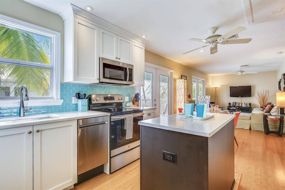 Kitchen features an island and modern appliances.