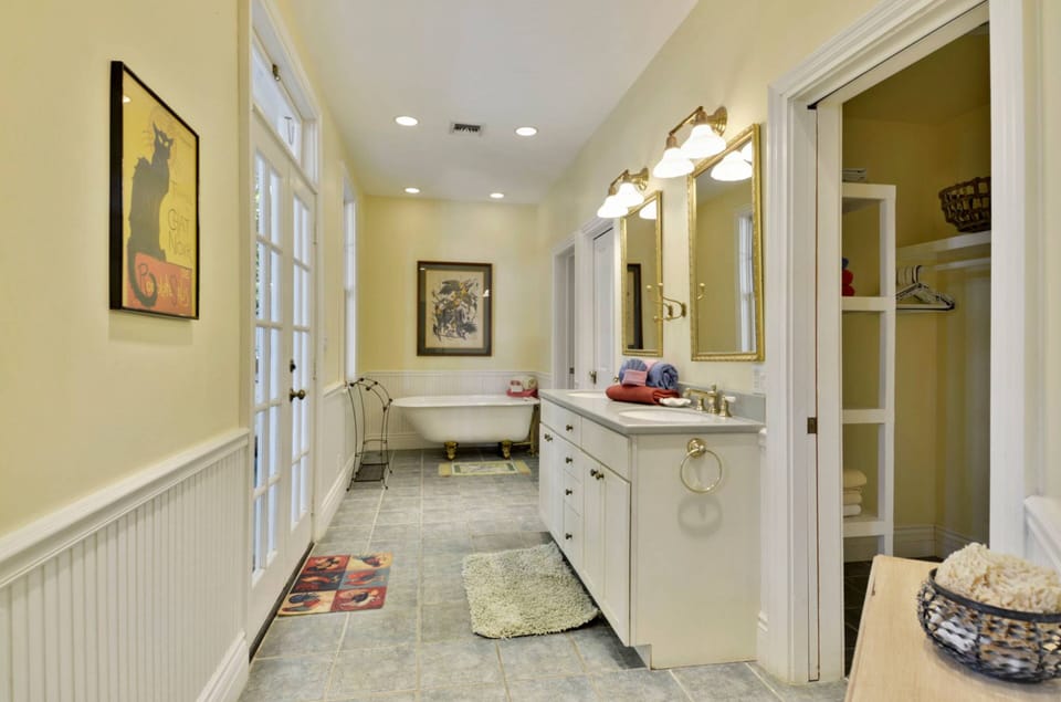 Spacious full bathroom with a standing tub.