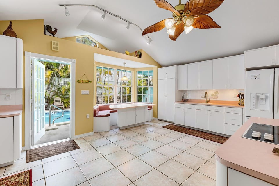 Spacious open layout with a bright kitchen, vaulted ceilings, and a cozy living area for gathering.