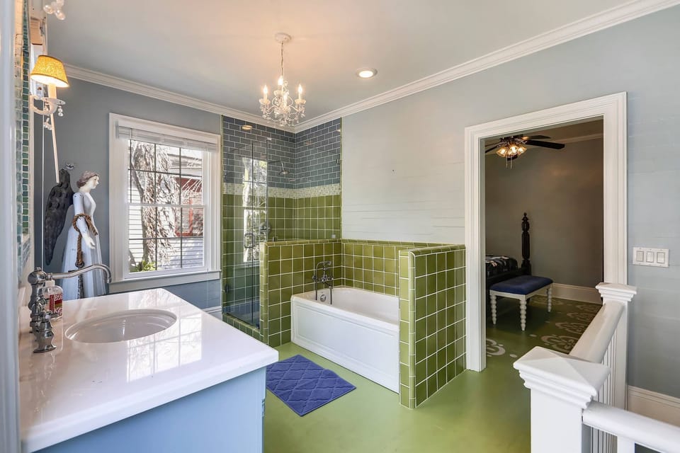 Full bathroom features a standing tub.