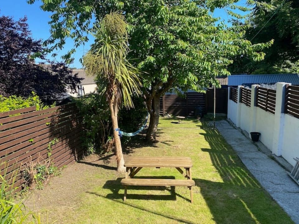 A large private garden with bench table for 6.