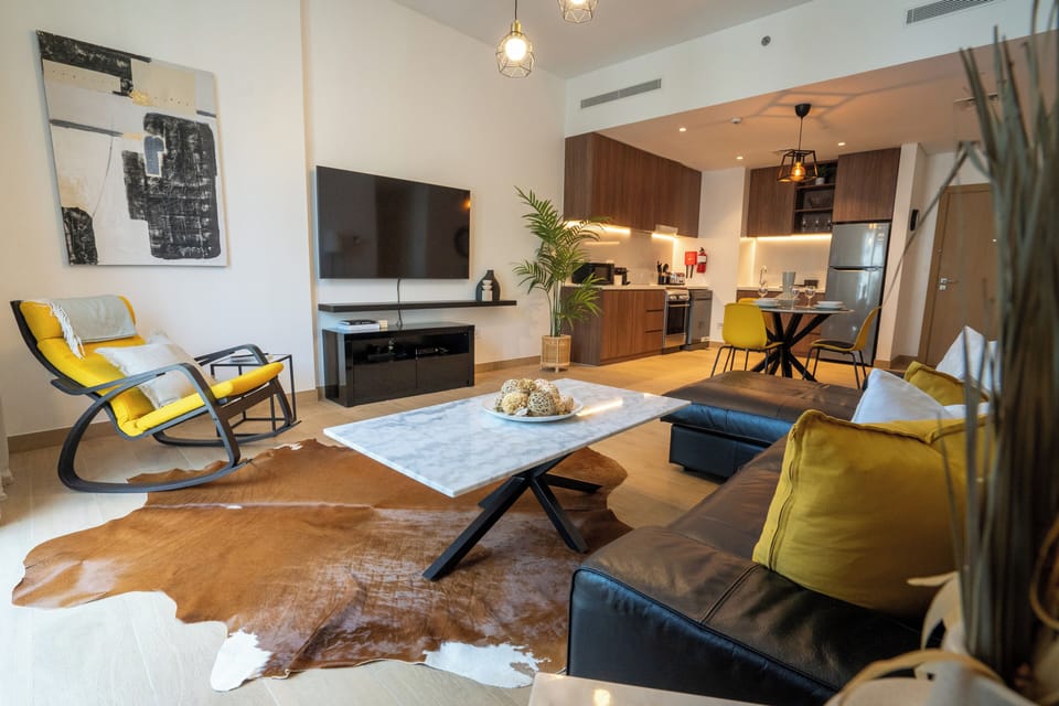 Deluxe Apartment | Living area | 55-inch Smart TV with cable channels, TV, Netflix