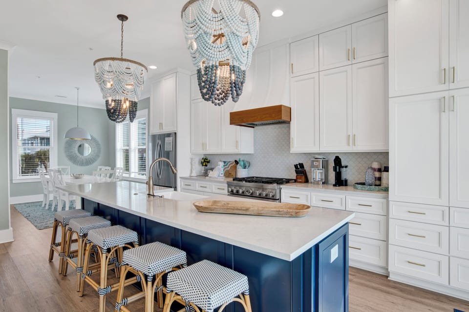Stunning kitchen with stone counters and bar seating at the kitchen island
