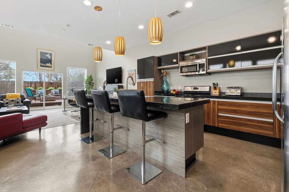 Kitchen with a breakfast bar and seats for three—great for casual meals or morning coffee.