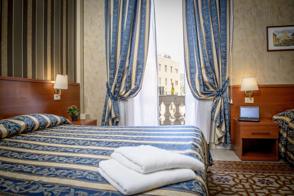 Triple Room | Minibar, in-room safe, desk, soundproofing
