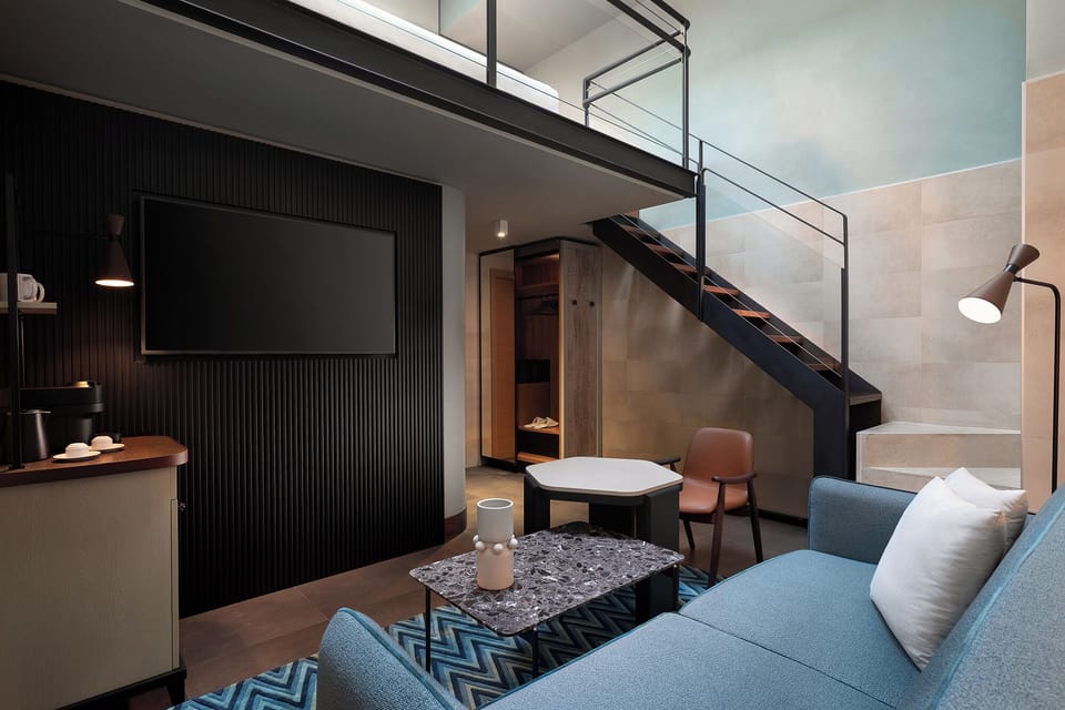 Suite, 1 King Bed | In-room safe, desk, blackout drapes, iron/ironing board