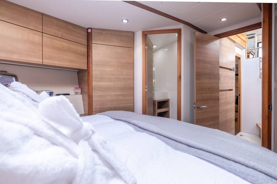 Master cabin showing the private en suite just steps from the double bed.