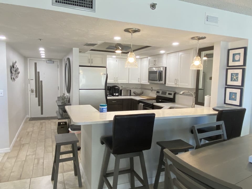 Four barstools around bar in kitchen