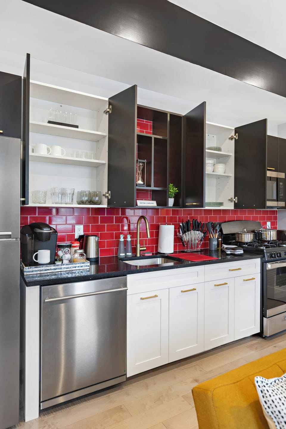 Fully-equipped kitchen with modern stainless steel appliances, ample countertop space, and a wide range of cookware, ensuring a seamless cooking experience for all your culinary needs.
