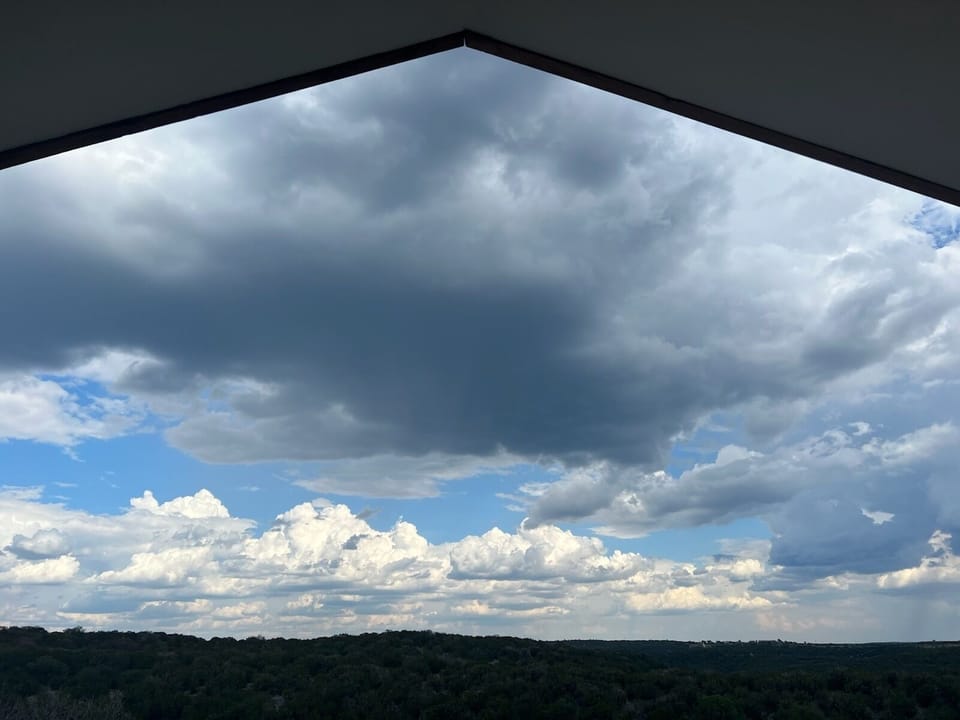 A view to the clouds above from a comfy chair on the back porch.