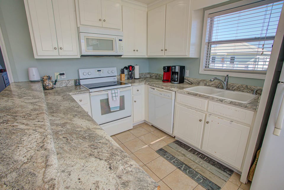 Kitchen with utensils and coffee maker - Keurig and Carafe