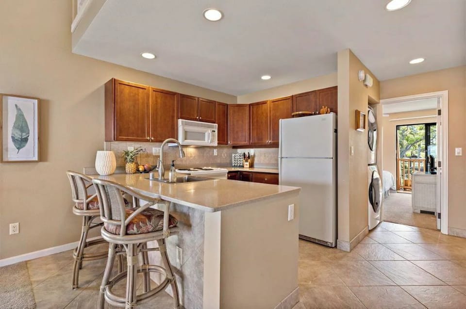 well stocked kitchen for all your cooking needs, complete with ocean view