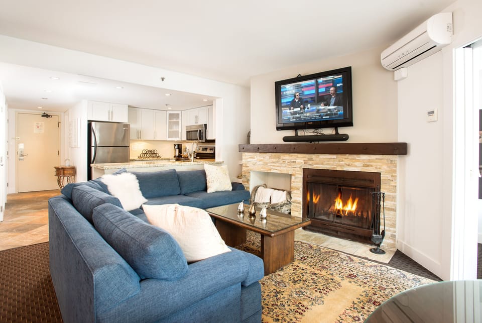 A beautiful fire in the living room with a NEW SMART TV