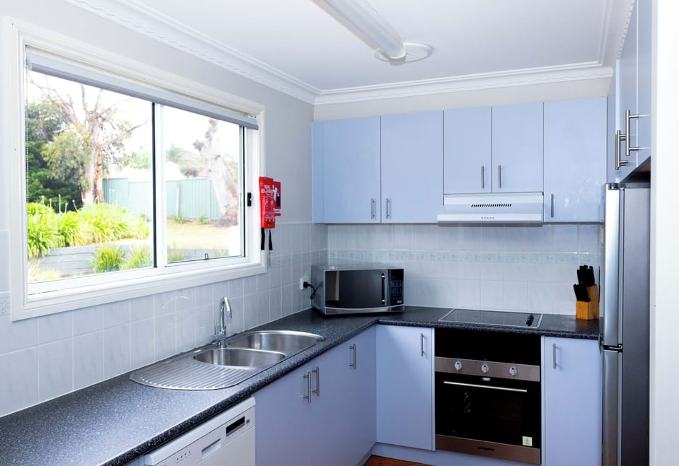 Deluxe Cabin, 4 Bedrooms | Private kitchen | Full-size fridge, microwave, oven, dishwasher