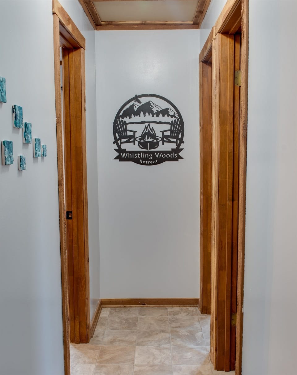 View of Hallway. Primary is on the left. Bunkbed room is the back right. Bathroom is the first door on your right.