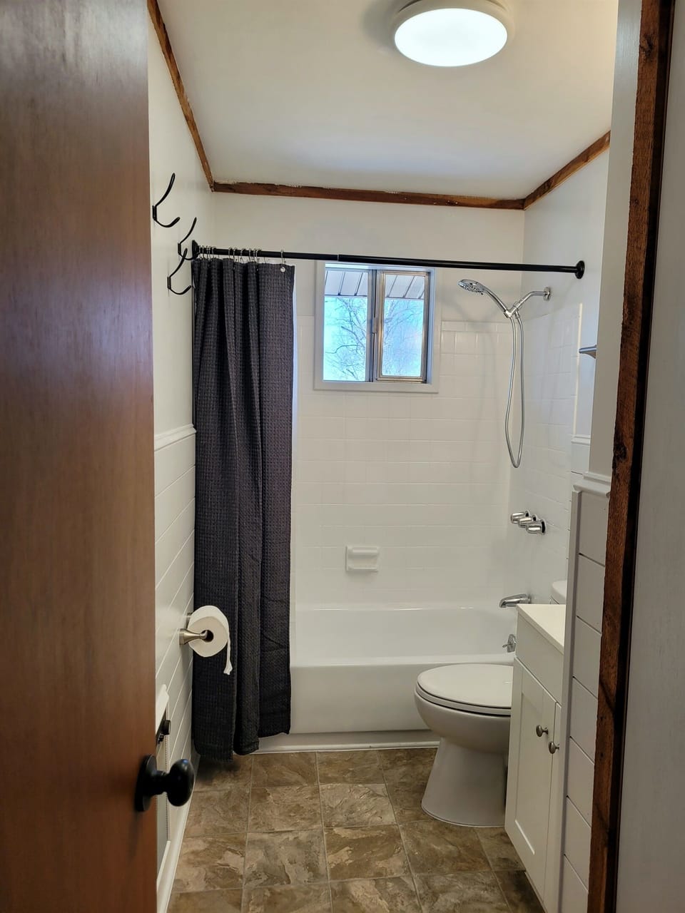 Full bathroom with shower/tub combo.