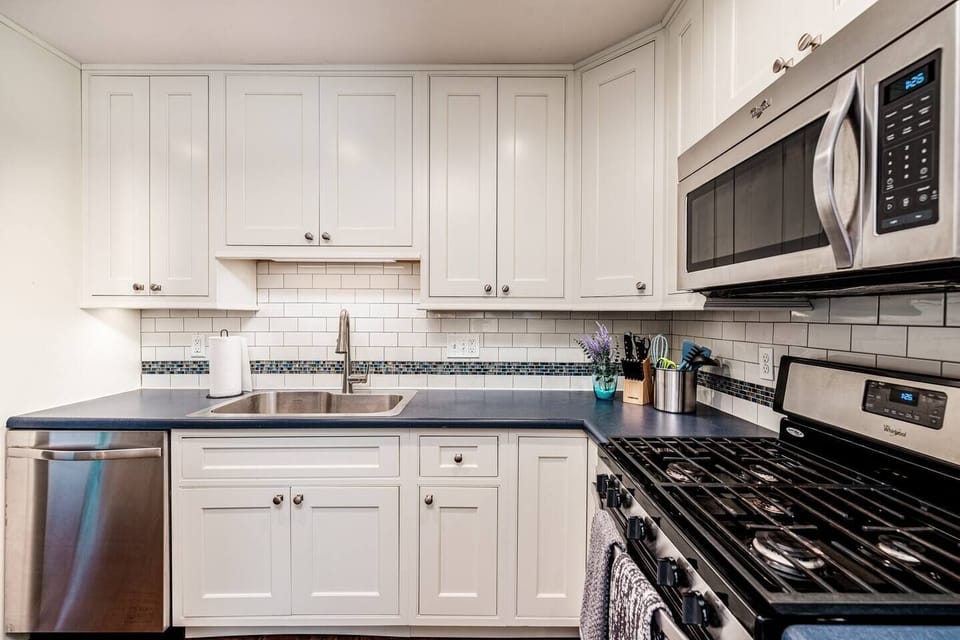 Kitchen with large island, drip coffeemaker, and Keurig