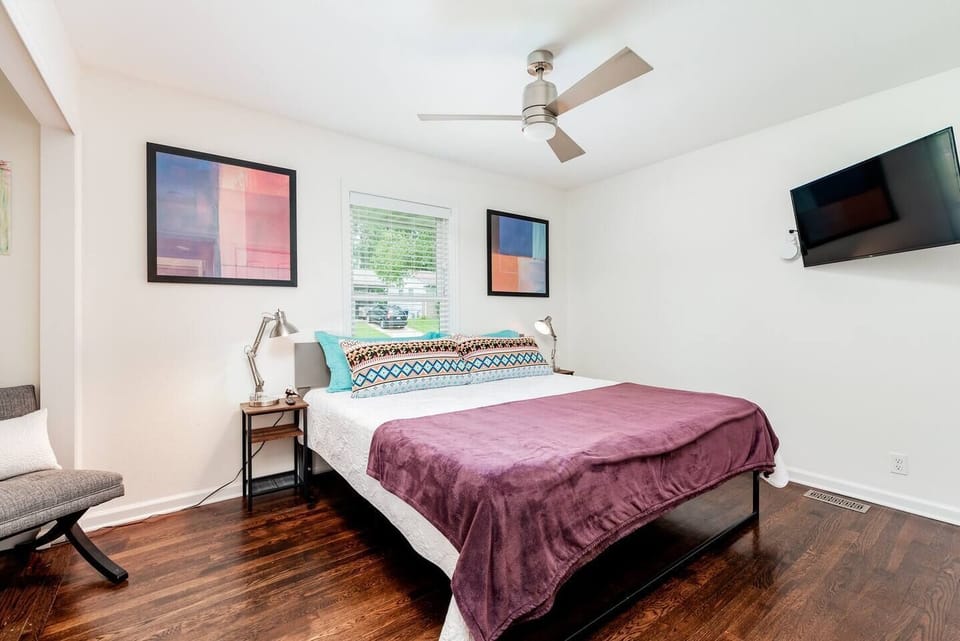 Bedroom 2 with king bed, reading nook, and Roku tv