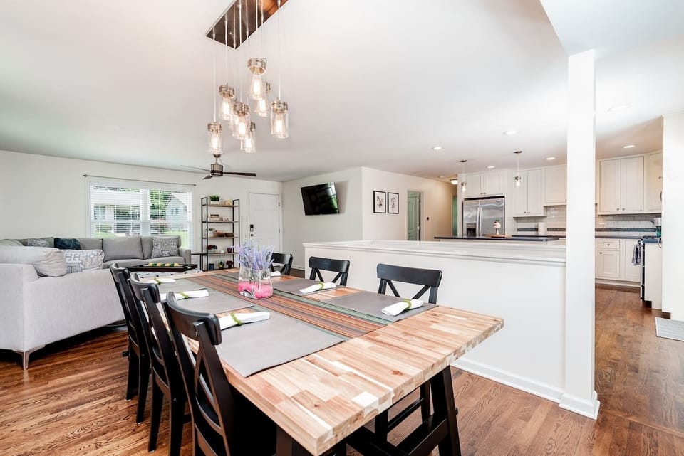View of open sight lines among the dining area, kitchen, and living room