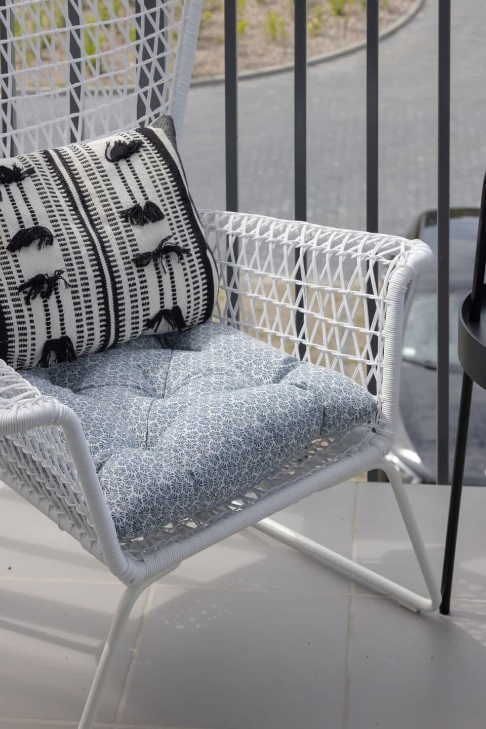 The balcony's stylish design complements the apartment's decor. 