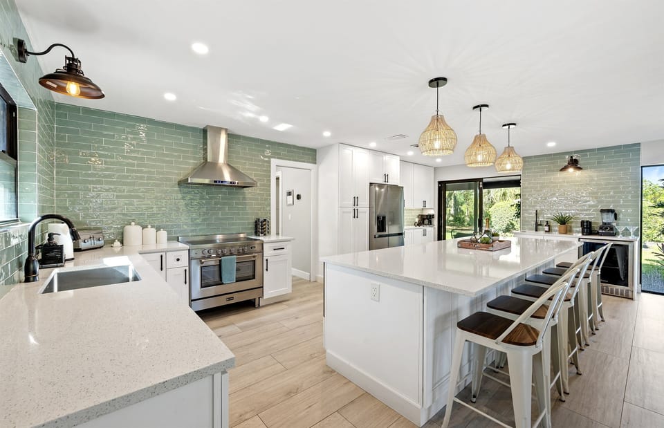 This stunning, open-concept kitchen is a showpiece — designed for gourmet meals and gathering with ease