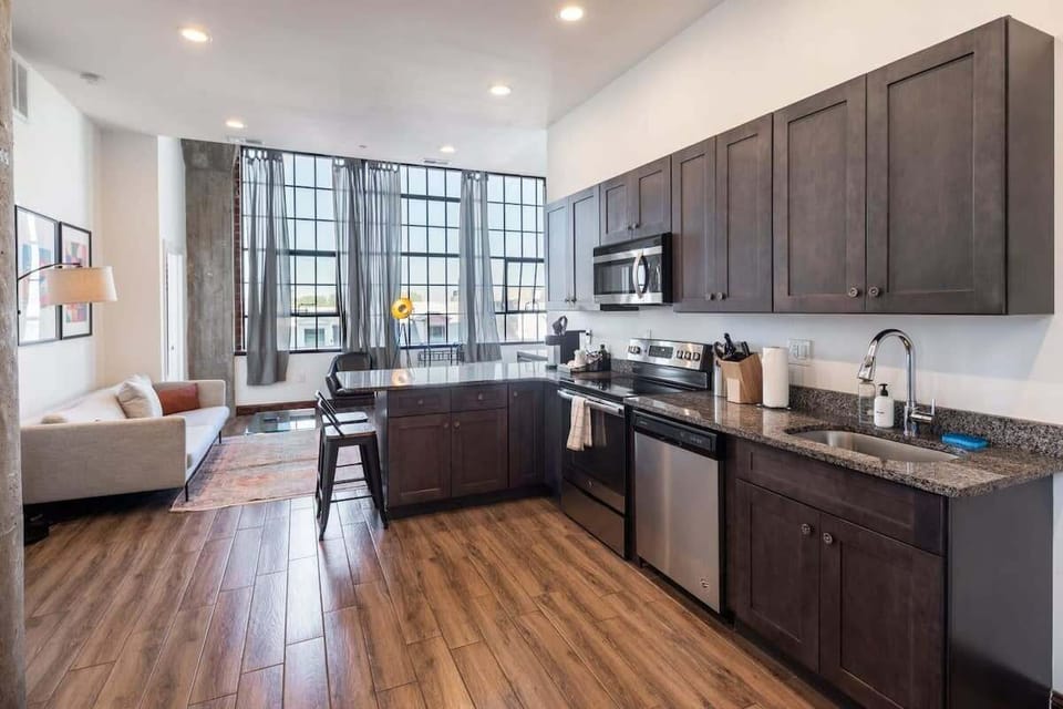 Enjoy home-cooked or the neighborhood's best takeout in this lovely kitchen with stainless steel appliances and a full-sized refrigerator.