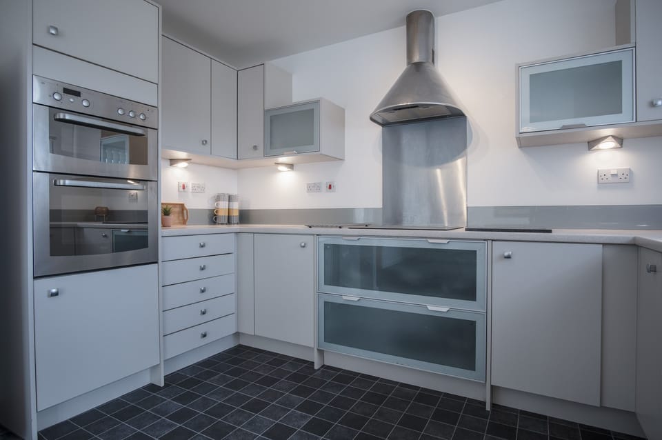 Exclusive Apartment | Private kitchen | Full-size fridge, microwave, oven, stovetop